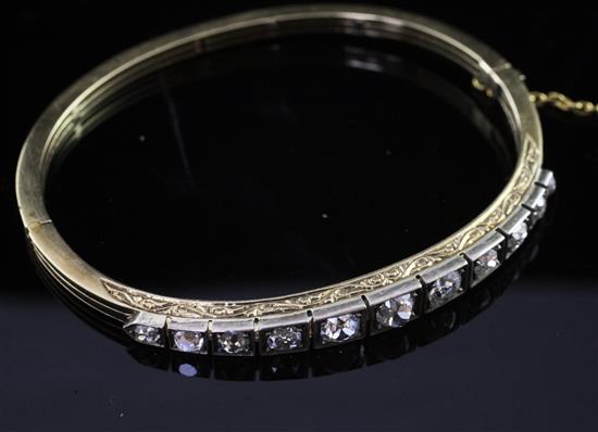 An Edwardian gold, silver and diamond hinged bangle,